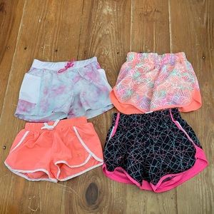 4 total pairs of shorts- 2 athletic works, 1 Tek gear size 7/8